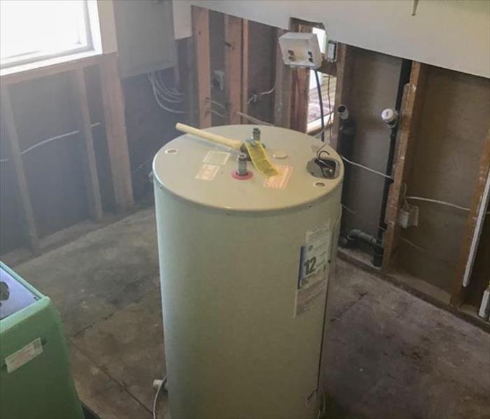 Hot water heater in a demolition basement