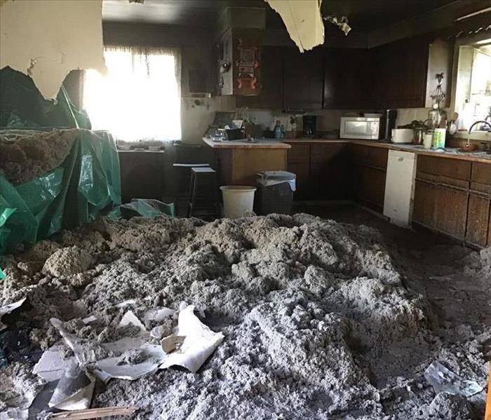 Heavy rains cause the ceiling to collapse in a Sumner, WA home