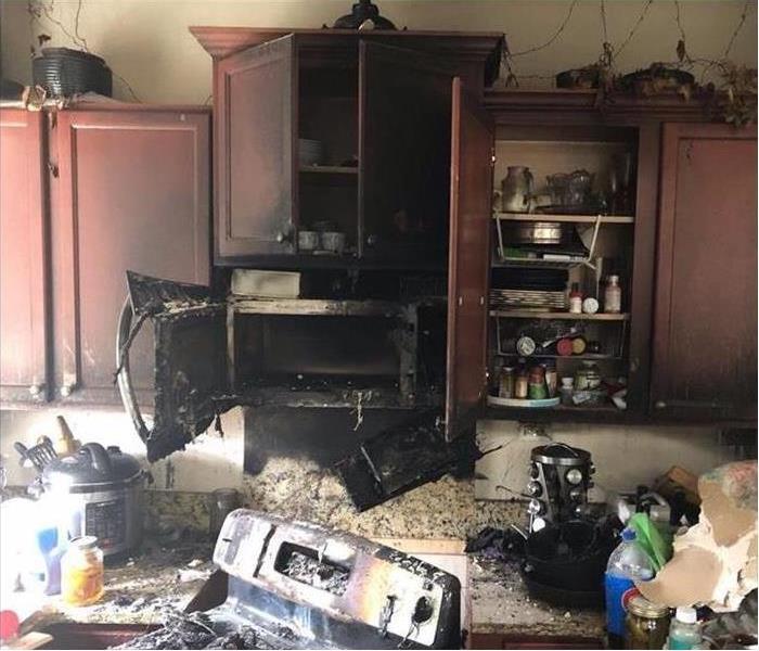 Kitchen Fire, cabinets and stove burnt