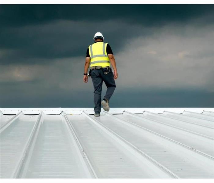 Construction engineer, uniform safety application, inspection metal roofing works for industrial roofing 