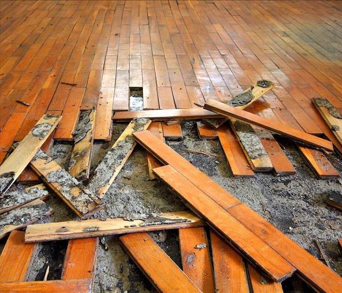 Wooden floor damaged due to water damage